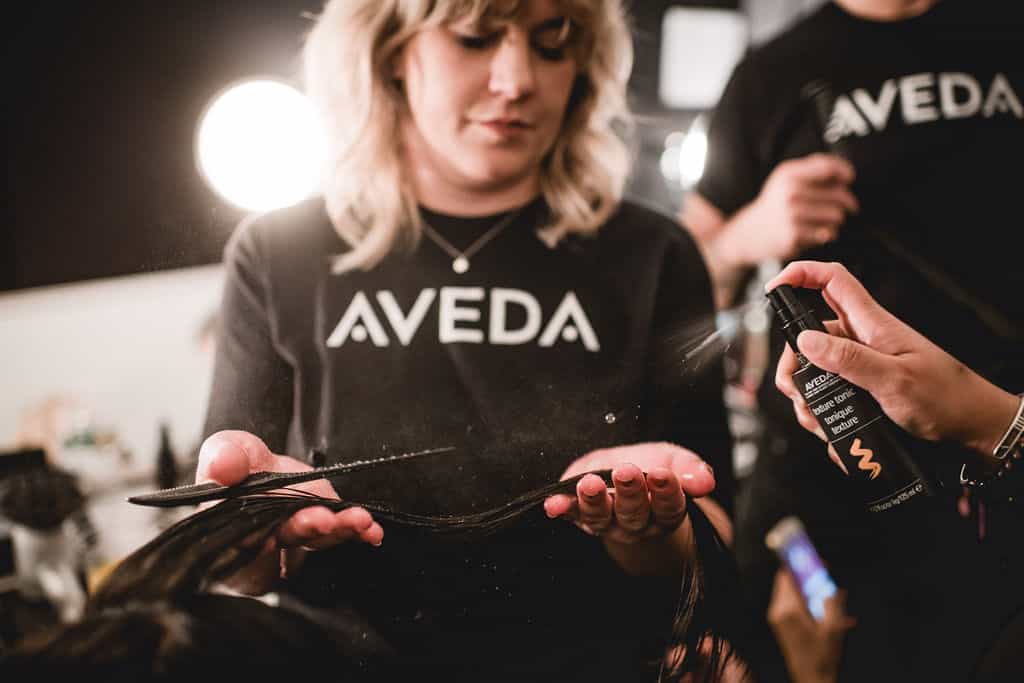 AVEDA Professionals working on a model